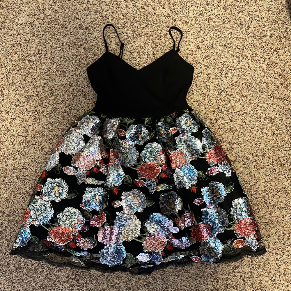 Homecoming dress. It’s a black Teeze Me dress with flowers. Size 3-4